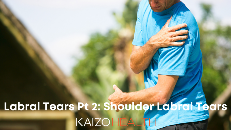 man holding his left shoulder because of labral tear pain