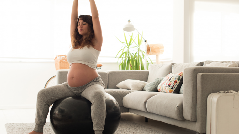 prenatal woman using chiropractic exercises to relieve pain during pregnancy